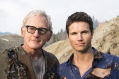 Victor Garber and Robbie Amell pose at the quarry near Vancouver where they shot Firestorm’s nuclear separation for The Flash