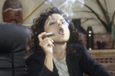 Julia Louis-Dreyfus smoking a cigar as Elaine Benes in Seinfeld