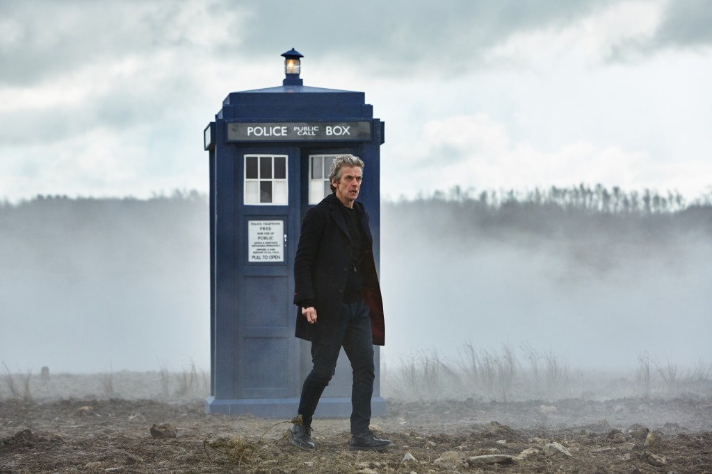 The Doctor stands outside his TARDIS