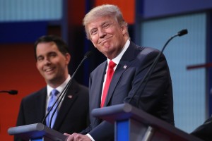 CLEVELAND, OH - AUGUST 06: Republican presidential candidates Donald Trump (R) and Wisconsin Gov. Scott Walker participate in the first prime-time presidential debate hosted by FOX News and Facebook at the Quicken Loans Arena August 6, 2015 in Cleveland, Ohio. The top-ten GOP candidates were selected to participate in the debate based on their rank in an average of the five most recent national political polls. (Photo by Chip Somodevilla/Getty Images)