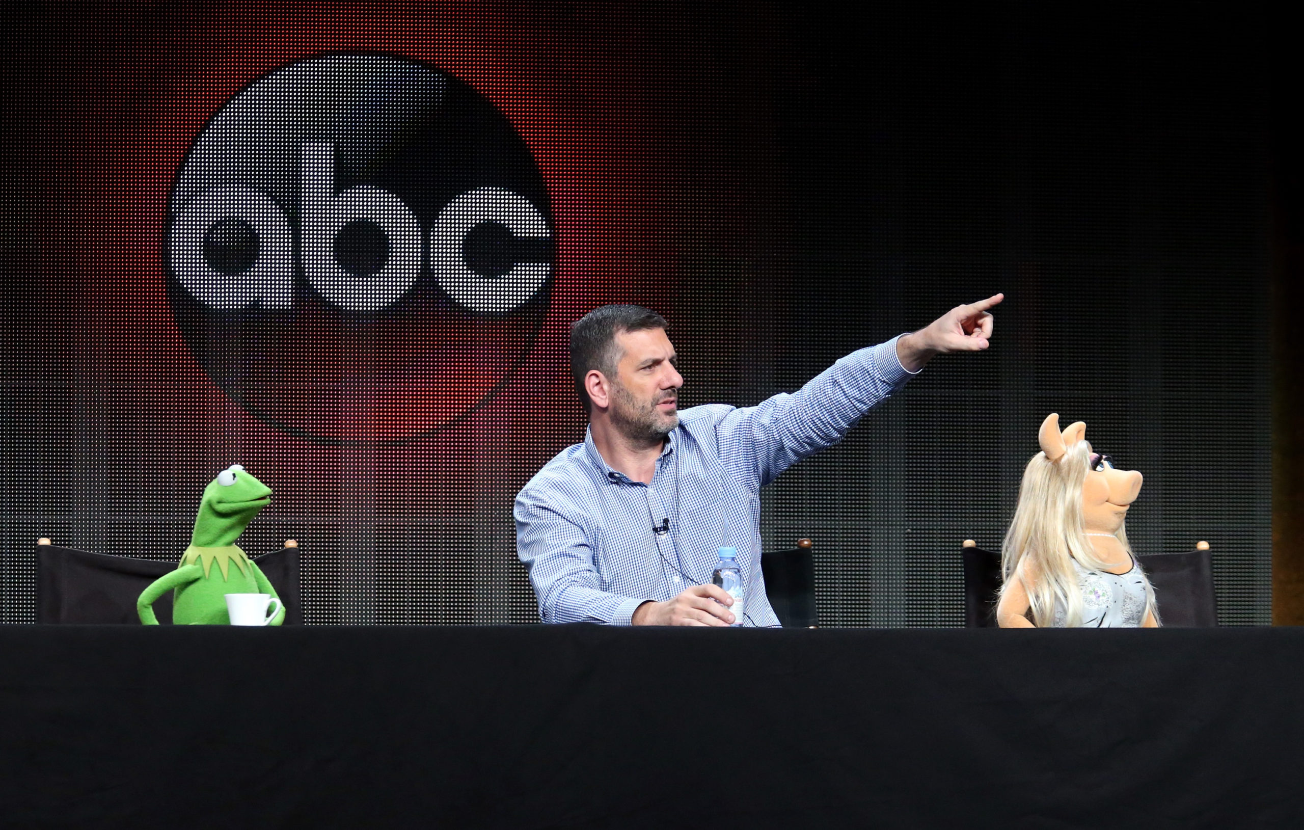 Kermit the Frog, writer/executive producer Bob Kushell and Miss Piggy speak onstage during the 'The Muppets' panel discussion at the ABC Entertainment portion of the 2015 Summer TCA Tour