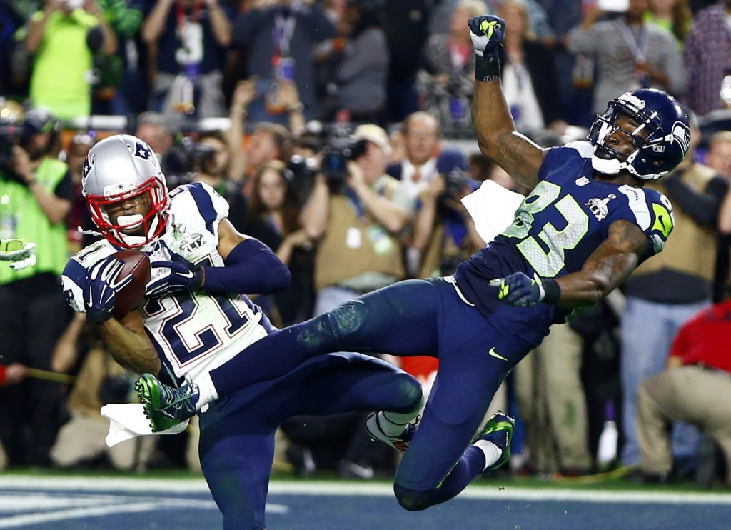 Feb 1, 2015; Glendale, AZ, USA; New England Patriots strong safety Malcolm Butler (21) intercepts a pass intended for Seattle Seahawks wide receiver Ricardo Lockette (83) in the fourth quarter in Super Bowl XLIX at University of Phoenix Stadium. Mandatory Credit: Mark J. Rebilas-USA TODAY Sports