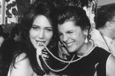 Hunter Tylo biting the pearls of TV soap Bold And The Beautiful co-star Kimberlin Brown at a party at Tavern On The Green before the Daytime Emmy Awards