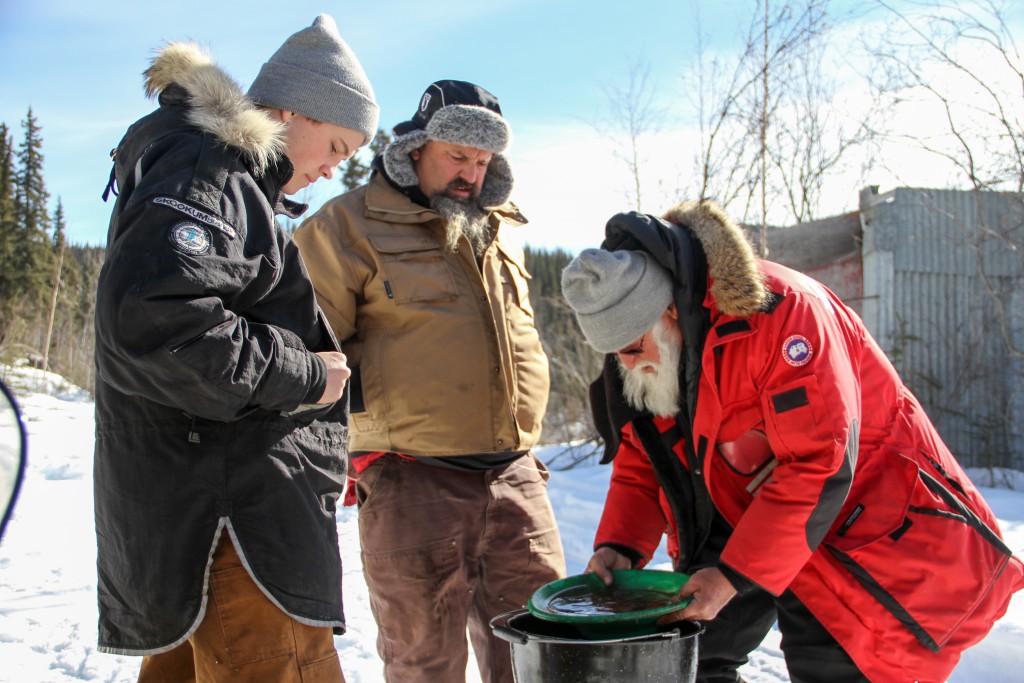 Hunter and Todd watch as Jack Hoffman pans some gold on Gold Rush