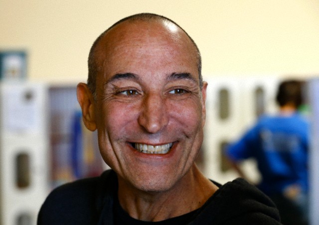 Hollywood mogul and co-creator of The Simpsons, Sam Simon, smiles while visiting the San Diego Humane Society after he financed the purchase of a chinchilla farm in Vista