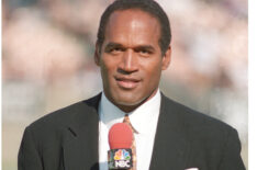 OJ Simpson serves as a NBC Sports sideline reporter for AFC Wild Card playoff game between the Denver Broncos and Oakland Raiders at the Los Angeles Memorial Coliseum on Jan. 9, 1994.