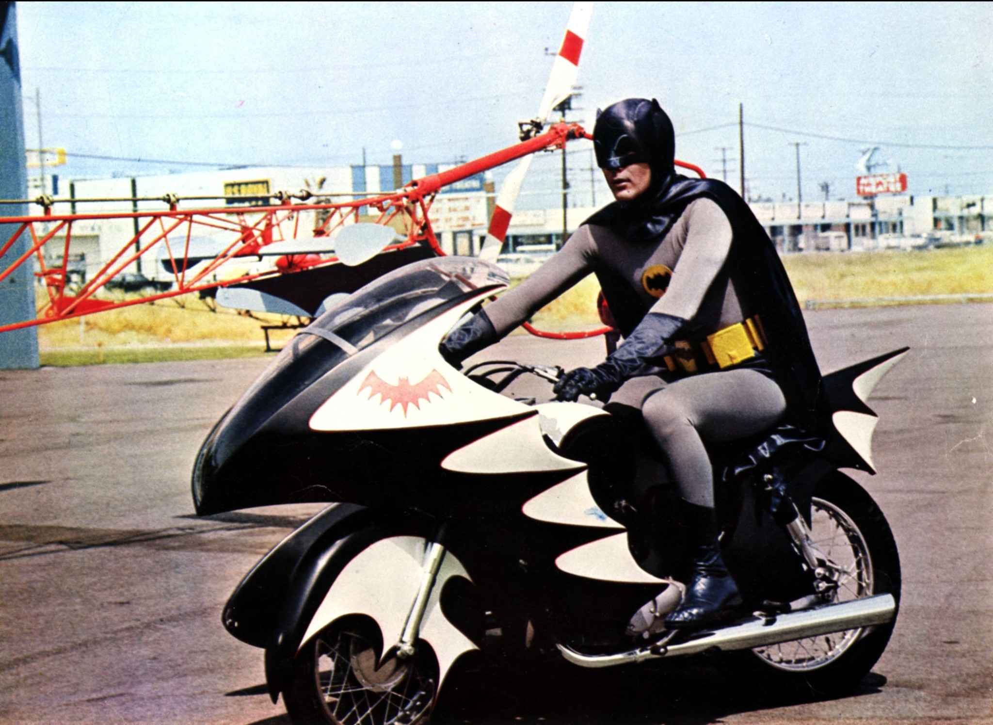 Adam West as Batman on the Batcycle