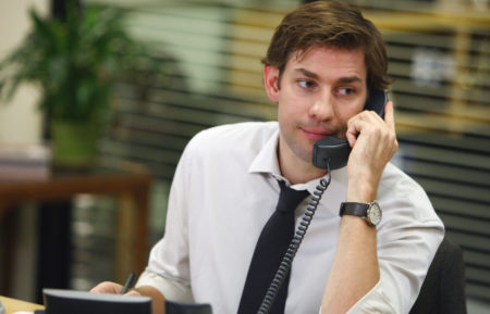 John Krasinski as Jim Halpert answering the phone on The Office