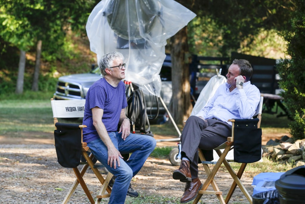 Executive Producer and Showrunner, Chris Black with Philip Glenister as “Reverend Anderson”