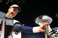 Peyton Manning #18 of the Denver Broncos is handed the Vince Lombardi Trophy after defeating the Carolina Panthers during Super Bowl 50