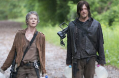 The Walking Dead - Carol (Melissa McBride) and Daryl (Norman Reedus) carry water jugs - Season 5, Episode 2