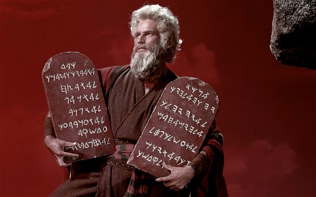 Charlton Heston as Moses holding the commandments in The Ten Commandments