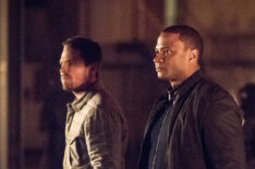 Arrow - Stephen Amell as Oliver Queen and David Ramsey as John Diggle