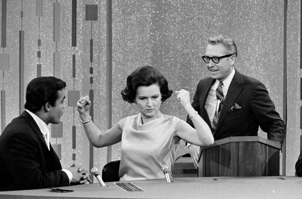 NEW YORK - FEBRUARY 7: Unidentified guest contestant, Betty White and Allan Ludden on the gameshow, PASSWORD. Image dated February 7, 1967. (Photo by CBS via Getty Images)