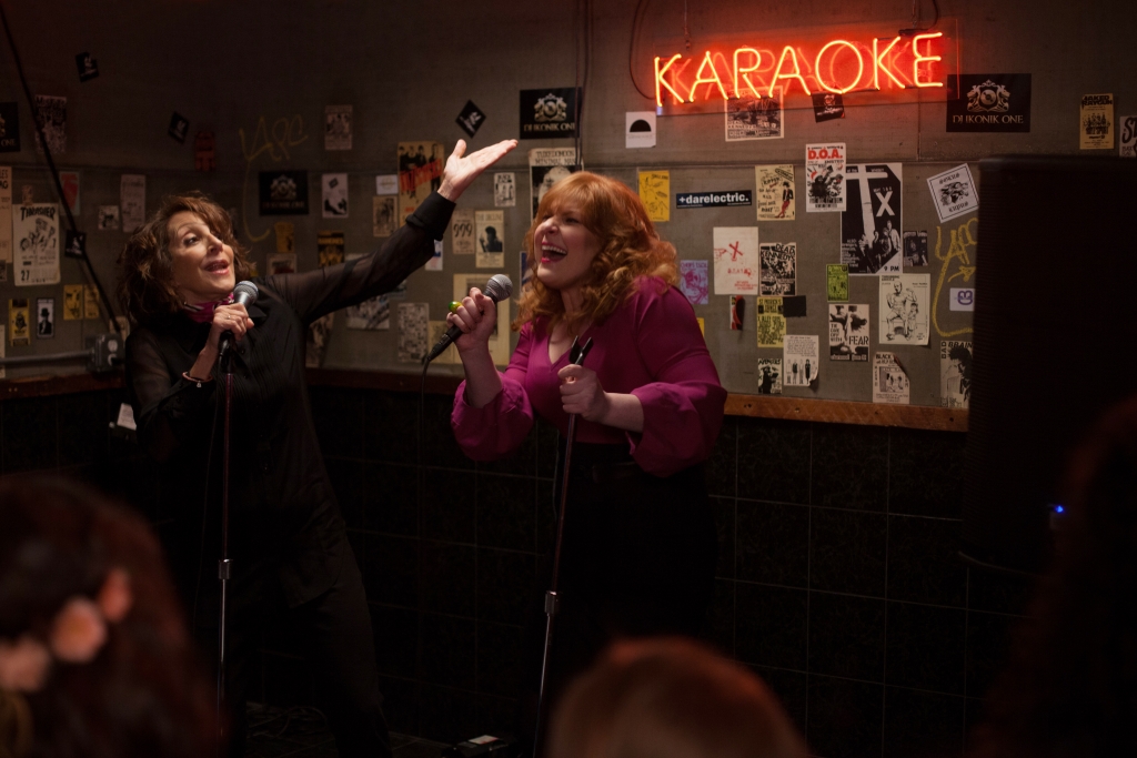 Andrea Martin as Marilyn Kessler and Julie Klausner as Julie Kessler singing karaoke in Difficult People