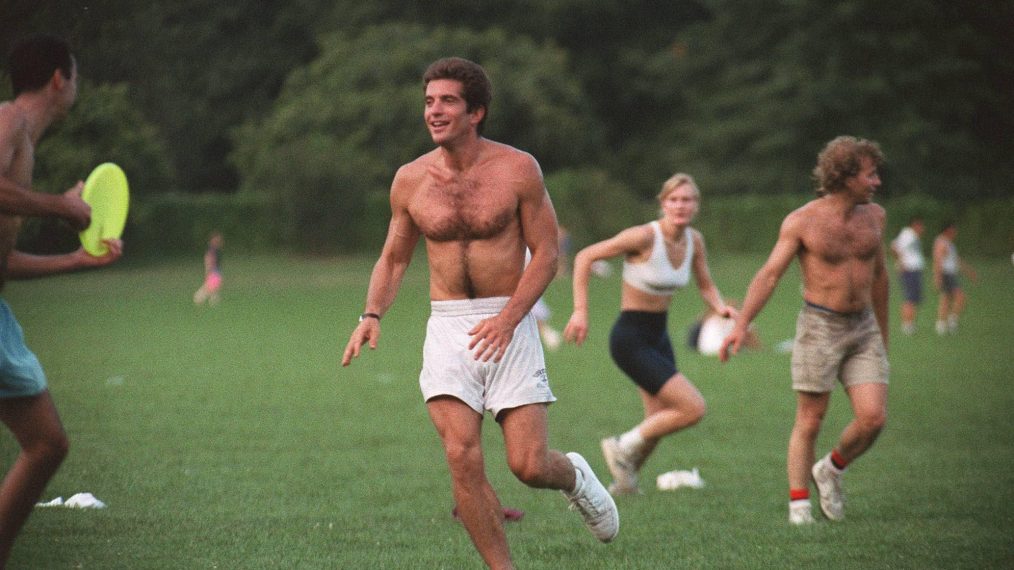 John F. Kennedy Jr. playing football in Central Park in 1994.