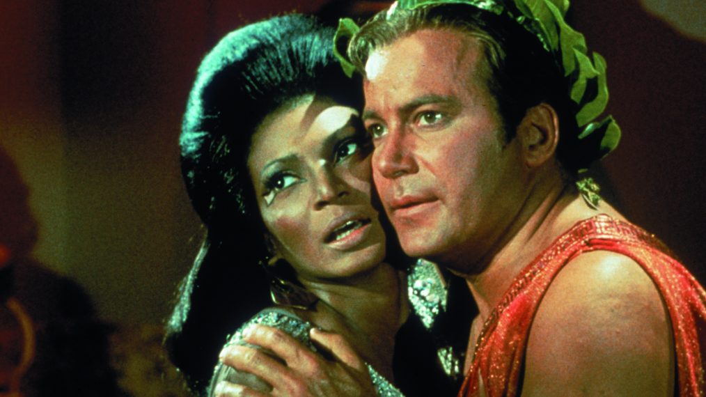 James T. Kirk and Nyota Uhura embrace in Star Trek