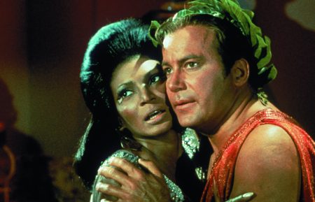 James T. Kirk and Nyota Uhura embrace in Star Trek