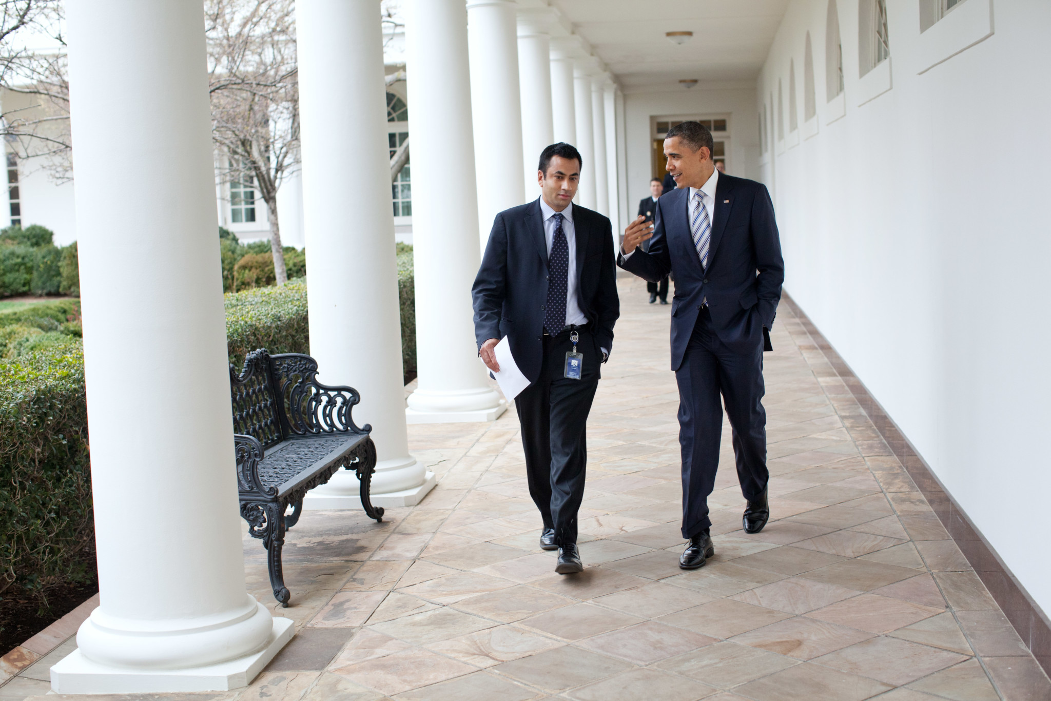 President Barack Obama walks with Kalpen Modi,