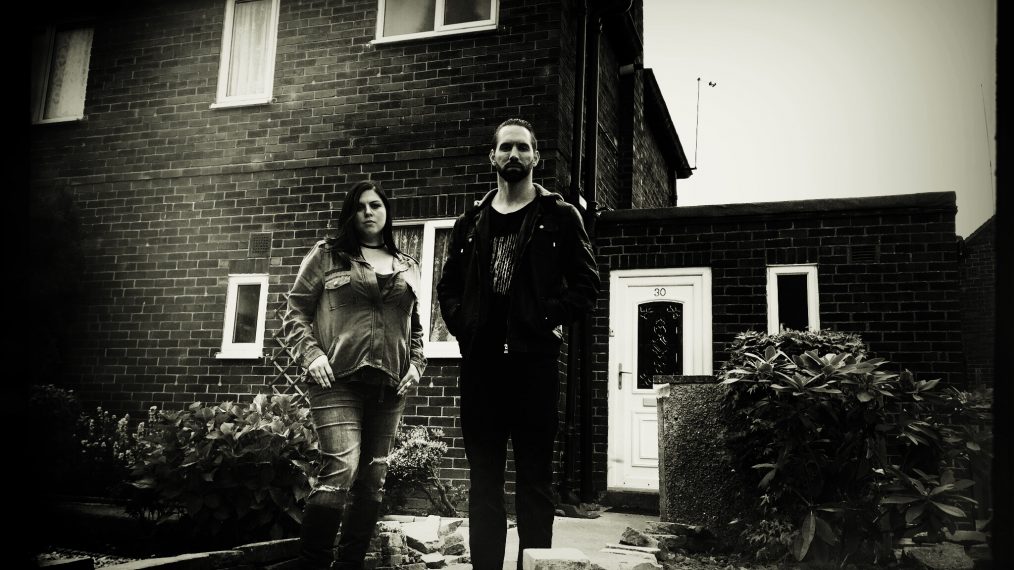 Destination America - Paranormal Lockdown: The Black Monk House - Katrina Weidman and Nick Groff stand in front of Black Monk House