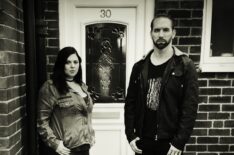 Katrina Weidman and Nick Groff stand in front of door of Black Monk House