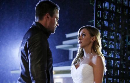 Arrow - Stephen Amell as Oliver Queen and Katie Cassidy as Laurel Lance