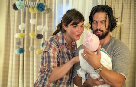 Mandy Moore as Rebecca and Milo Ventimiglia as Jack holding a baby in This is Us - 'Kyle'