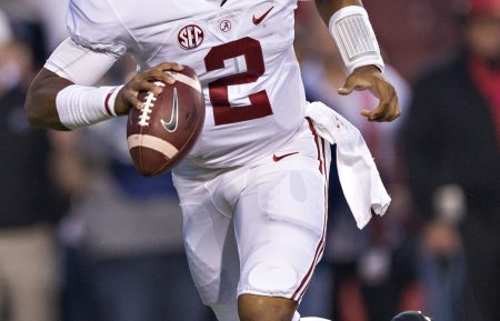 Jalen Hurts #2 of the Alabama Crimson Tide rolls out to pass during a game against the Arkansas Razorbacks at Razorback Stadium on October 8, 2016 in Fayetteville, Arkansas