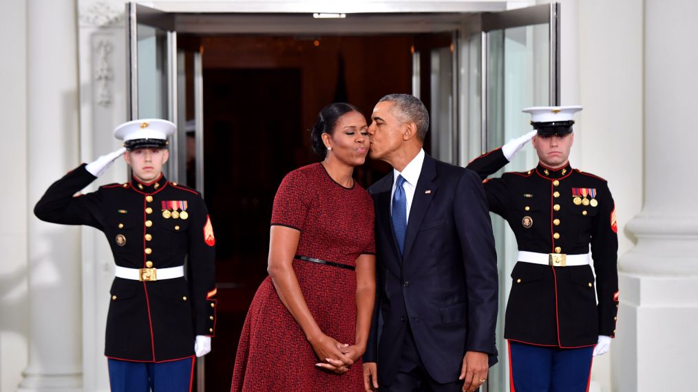 President Barack Obama gives Michelle Obama a kiss as they wait for President-elect Donald Trump and wife Melania at the White House before the inauguration on January 20, 2017 in Washington, DC