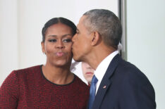 President Barack Obama gives a kiss to his wife first lady Michelle Obama before the arrival of President-elect Donald Trump and his wife Melania Trump, at the White House