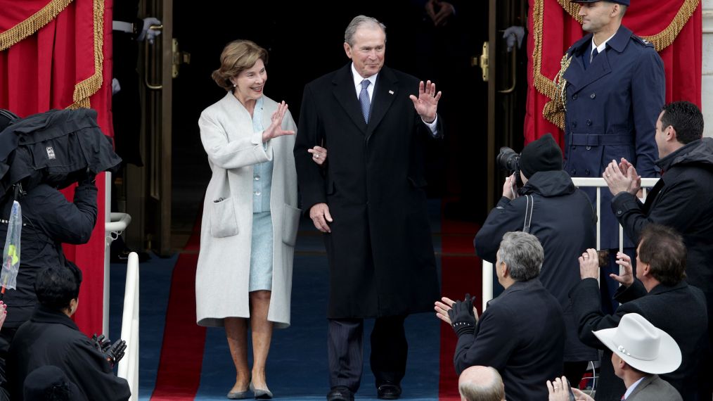 Former President George W. Bush and Laura Bush wave as they arrive on the West Front of the U.S. Capitol