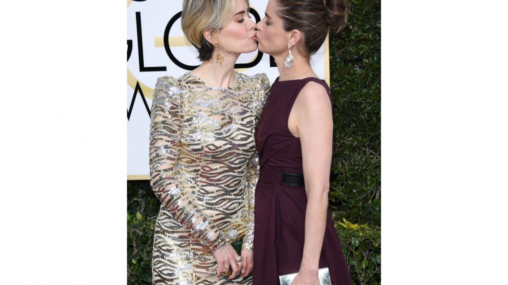 Sarah Paulson and Amanda Peet kiss at the 74th Annual Golden Globe Awards