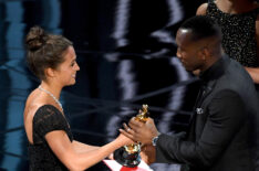 Mahershala Ali accepts Best Supporting Actor for 'Moonlight' from actor Alicia Vikander onstage during the 89th Annual Academy Awards