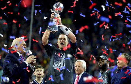 New England Patriots quarterback Tom Brady hoists the Vince Lombardi Trophy after his team's victory in Super Bowl LI