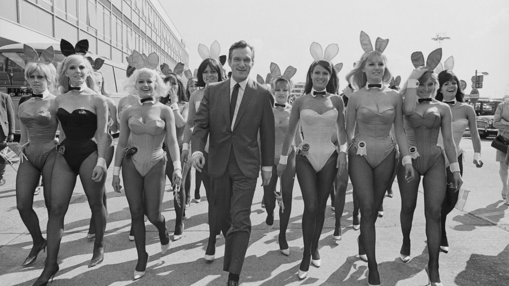 Playboy impresario Hugh Hefner with a group of bunny girls at London Airport in June 1966