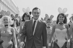 Playboy impresario Hugh Hefner with a group of bunny girls at London Airport in June 1966