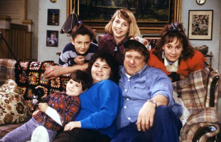 Roseanne - Michael Fishman as DJ Conner, Sara Gilbert as Darlene Conner, Roseanne Barr as Roseanne Conner, Alicia Goranson as Becky Conner, John Goodman as Dan Conner, and Laurie Metcalf as Jackie Harris