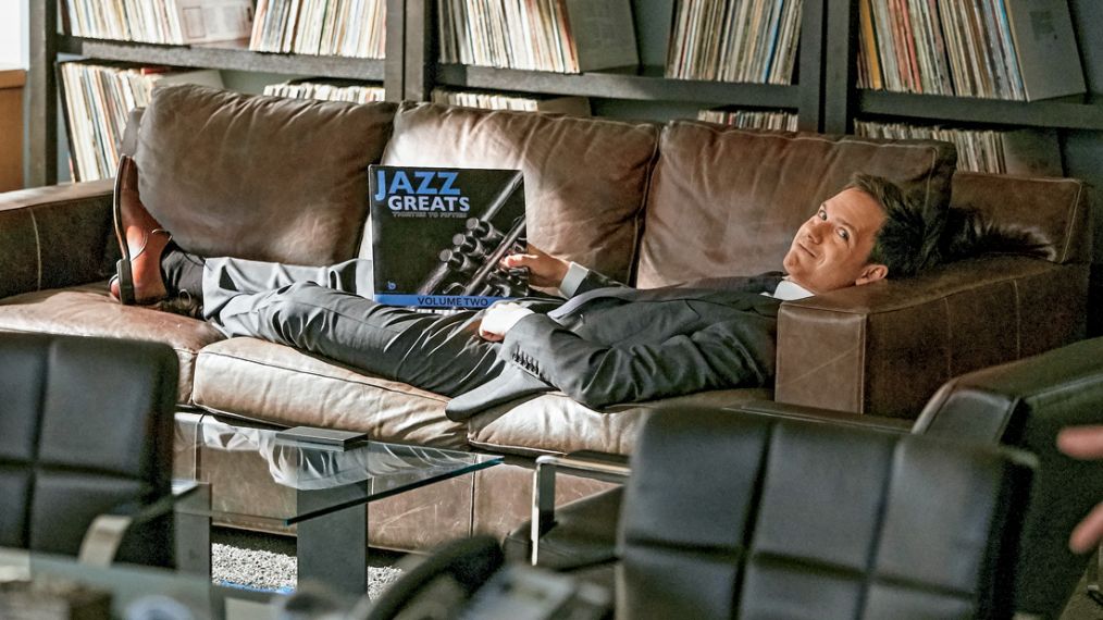 Patrick J. Adams in a record collection in Suits