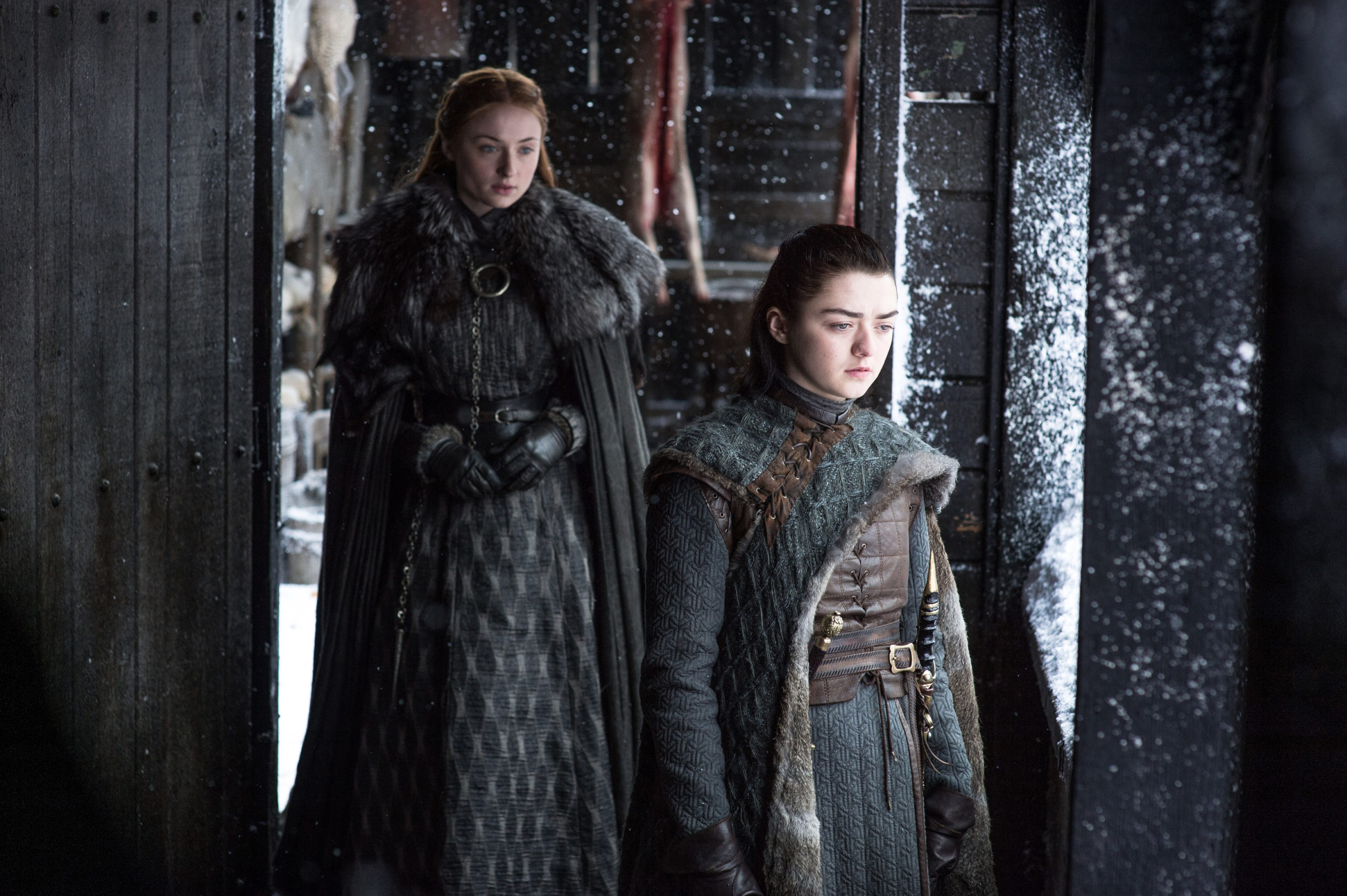 Game of Thrones - Sophie Turner as Sansa Stark and Maisie Williams as Arya Stark