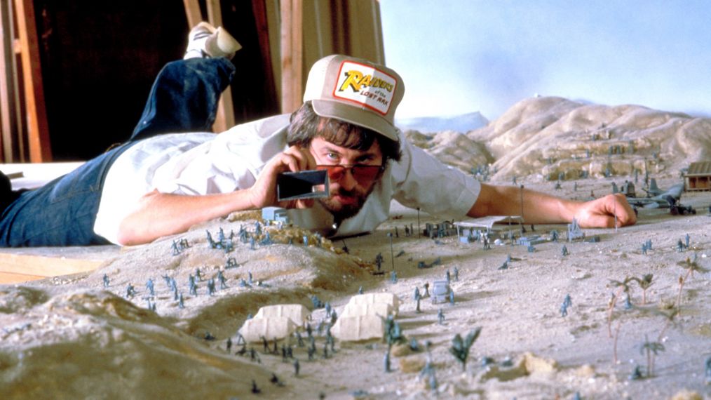 Director Steven Spielberg on a miniature set for Raiders of the Lost Ark