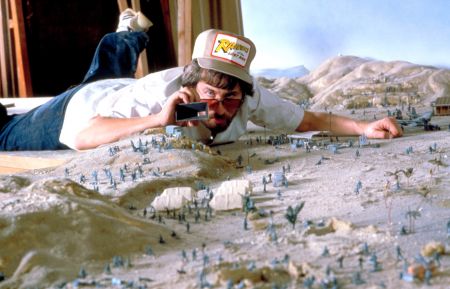 Director Steven Spielberg on a miniature set for RAIDERS OF THE LOST ARK, 1981, (c) Paramount/courte