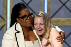 Elisabeth Moss accepts Outstanding Drama Series for 'The Handmaid's Tale' from Oprah Winfrey onstage during the 69th Annual Primetime Emmy Awards