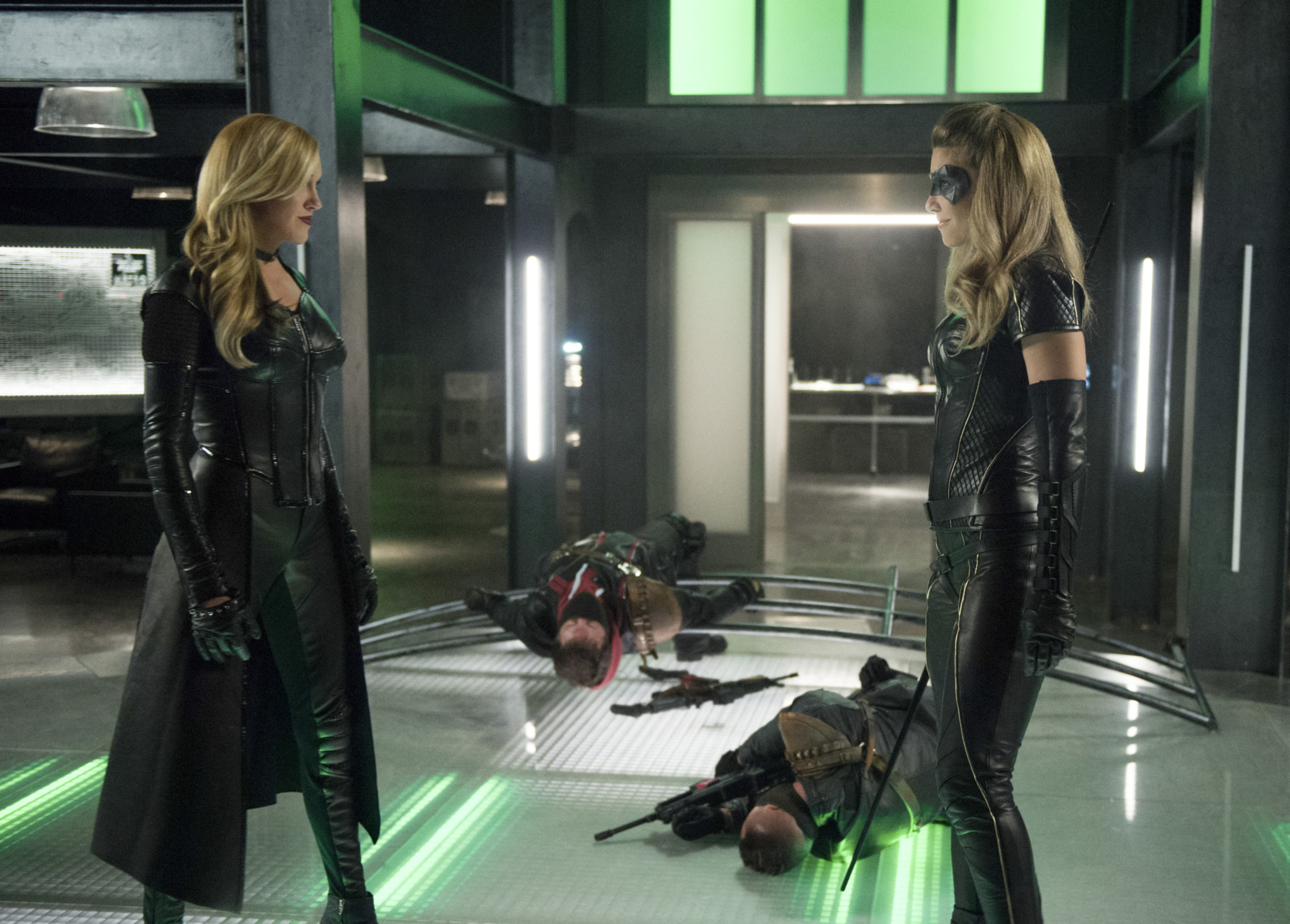 Katie Cassidy as Laurel Lance/Black Siren and Juliana Harkavy as Dinah Drake/Black Canary