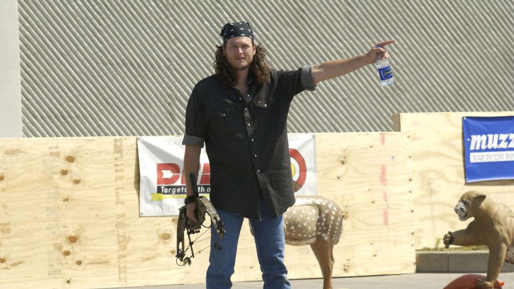 Blake Shelton with a banana and long hair prepares to compete in the Andy Griggs Celebrity Archery tournament during the 32nd annual FanFair country music festival in 2003