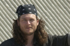 Blake Shelton with a banana and long hair prepares to compete in the Andy Griggs Celebrity Archery tournament during the 32nd annual FanFair country music festival in 2003