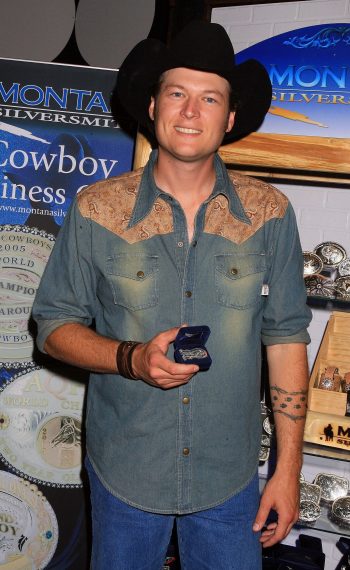 Blake Shelton poses with the Montana Silversmith Display at Distinctive Assets during the Academy of Country Music Awards