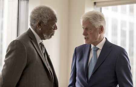 Host Morgan Freeman converses with President Bill Clinton as seen on National Geographic's The Story of Us with Morgan Freeman