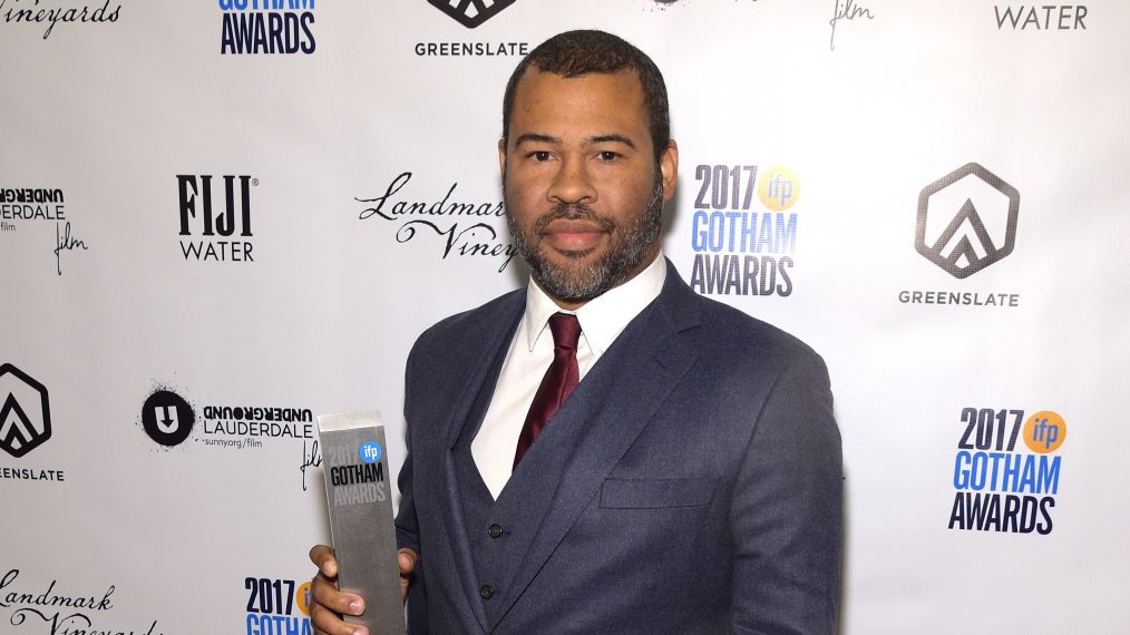 Jordan Peele poses with the award for Best Screenplay at The 2017 Gotham Awards