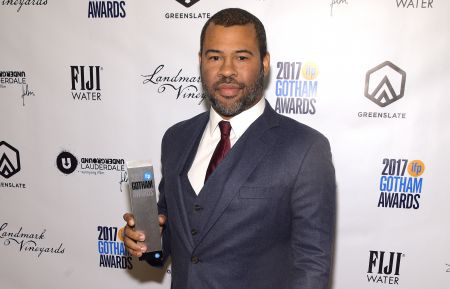 Jordan Peele poses with the award for Best Screenplay at The 2017 Gotham Awards