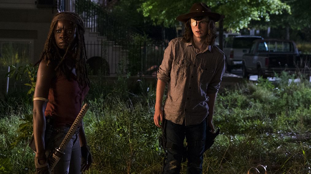 Danai Gurira as Michonne and Chandler Riggs as Carl Grimes in The Walking Dead